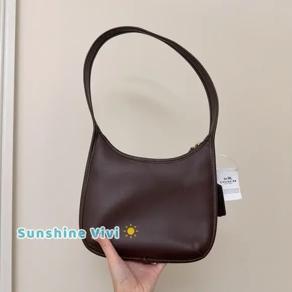 NWT Coach Curve Zip Bag in BRASS/Maple Glovetanned Leather CAF11